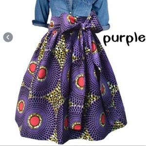 Floral print style skirt with bowl knot belt. Knee length. Size small.